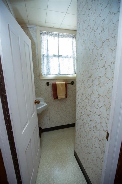195 West W Railroad Road Sycamore, PA 15364 - Photo 40 of 50 a bathroom with a granite countertop sink a window and shower