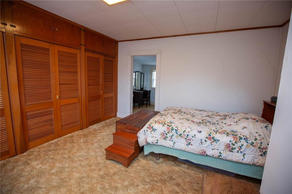 195 West W Railroad Road Sycamore, PA 15364 - Photo 42 of 50 a bedroom with a bed and dresser