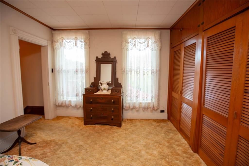 195 West W Railroad Road Sycamore, PA 15364 - Photo 45 of 50 a room with a bed and a window