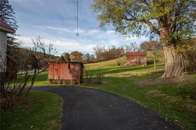 a backyard of a house with wooden fence