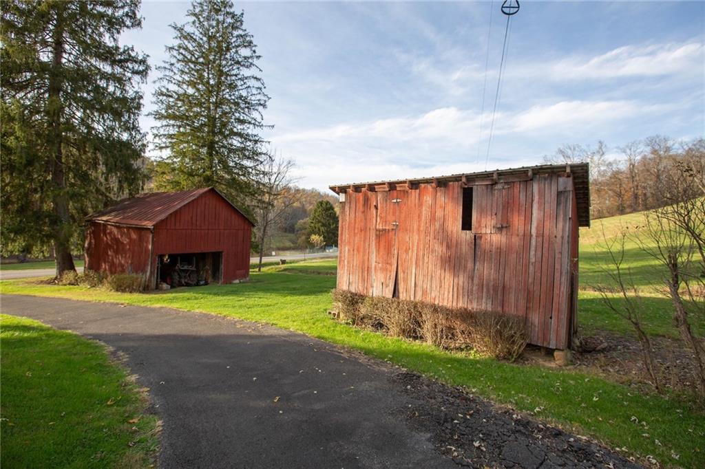 195 West W Railroad Road Sycamore, PA 15364 - Photo 8 of 50 a backyard of a house with wooden fence