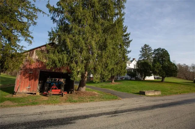 a view of a field with mountains in the background