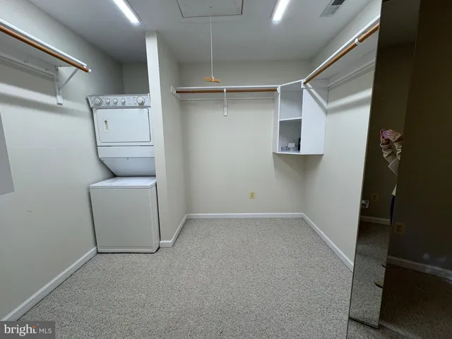 a view of storage and utility room with washer and dryer
