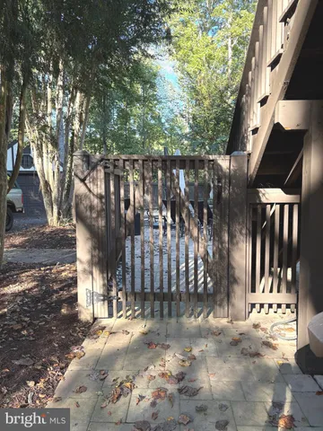 a view of outdoor space with wooden fence