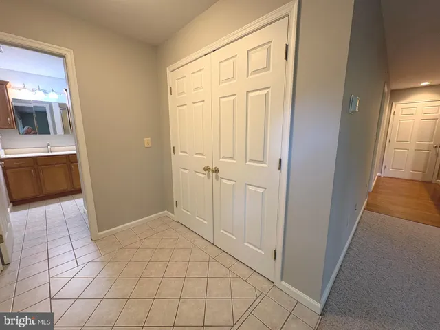 a view of a kitchen from the hallway