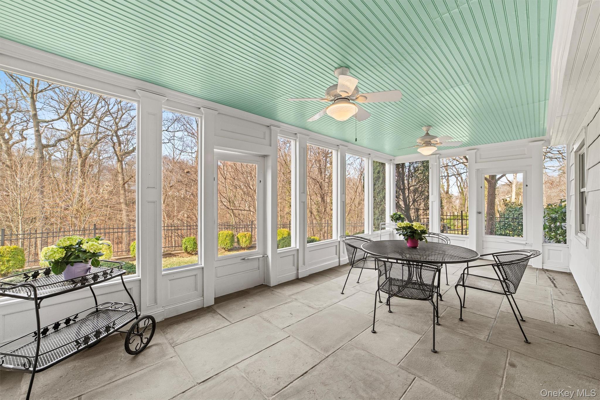 52 Oakledge Road Bronxville, NY 10708 - Photo 29 of 39 Sunroom / solarium with outdoor dining area, ceiling fan, and a healthy amount of sunlight