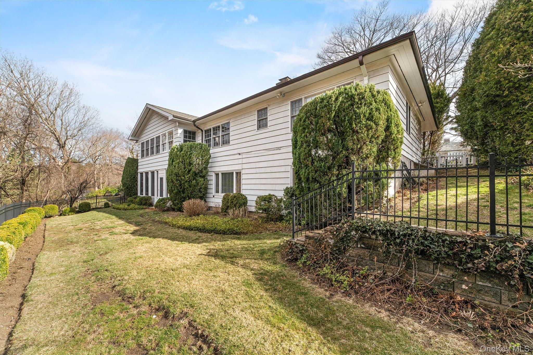 52 Oakledge Road Bronxville, NY 10708 - Photo 36 of 39 View of side of property with a yard and fence