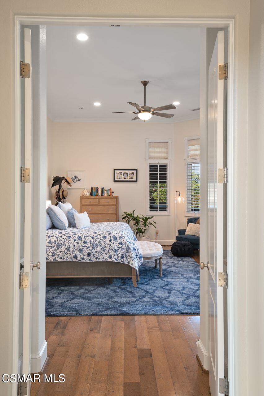 12490 MacDonald Drive Ojai, CA 93023 - Photo 14 of 87 a bedroom with a large bed and a chandelier