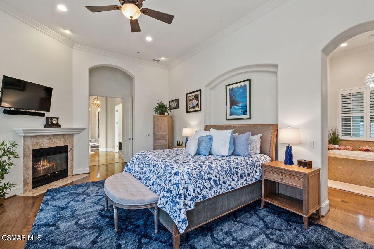 12490 MacDonald Drive Ojai, CA 93023 - Photo 16 of 87 a bedroom with a bed and a fireplace