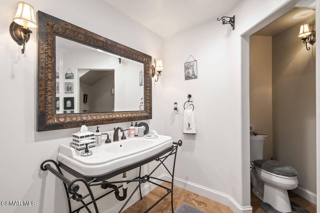 12490 MacDonald Drive Ojai, CA 93023 - Photo 30 of 87 a bathroom with a sink and a mirror