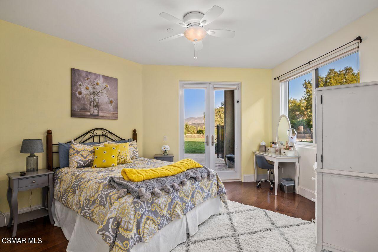 12490 MacDonald Drive Ojai, CA 93023 - Photo 31 of 87 a bedroom with a bed and a chandelier