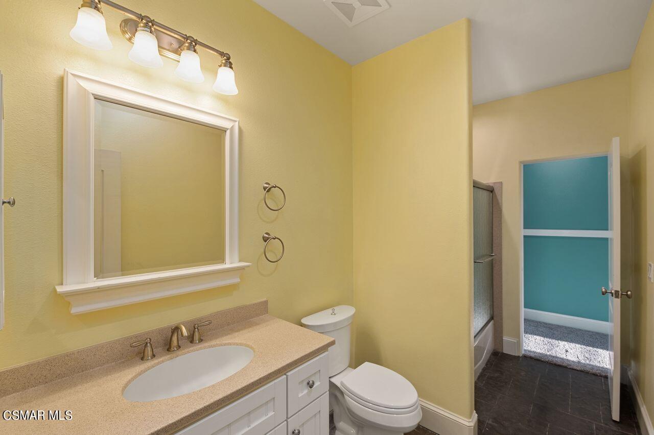 12490 MacDonald Drive Ojai, CA 93023 - Photo 43 of 87 a bathroom with a granite countertop sink toilet and shower