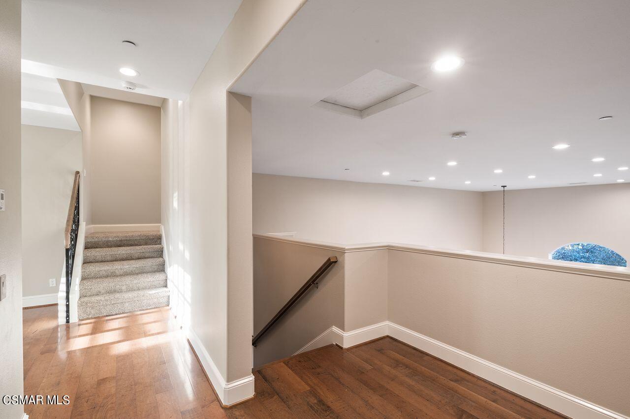 12490 MacDonald Drive Ojai, CA 93023 - Photo 47 of 87 a view of an empty room with wooden floor and stairs