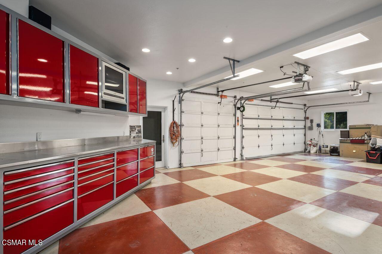 12490 MacDonald Drive Ojai, CA 93023 - Photo 57 of 87 a kitchen with stainless steel appliances granite countertop a sink and cabinets