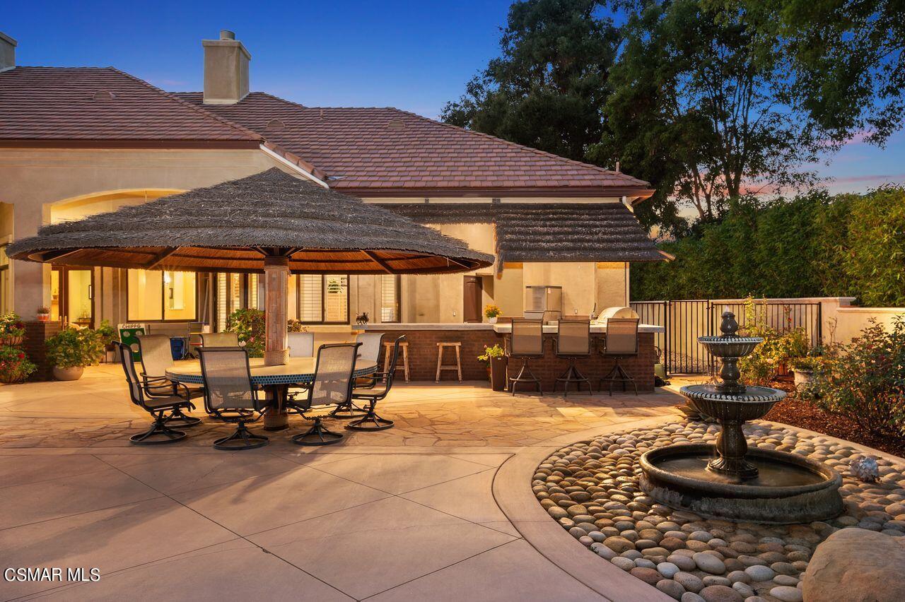 12490 MacDonald Drive Ojai, CA 93023 - Photo 85 of 87 a view of a patio with table and chairs and a fire pit