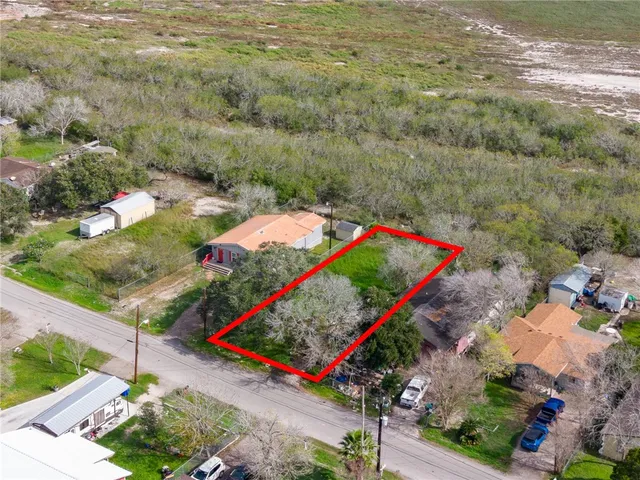a aerial view of a house with a lake view