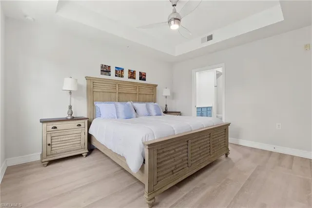a bed room with a bed and cabinets