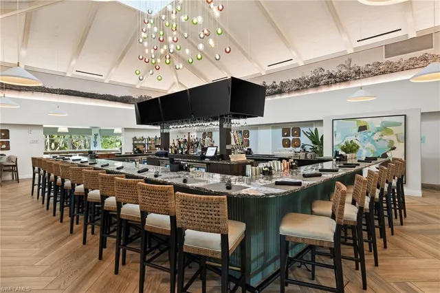 a group of people sitting at kitchen