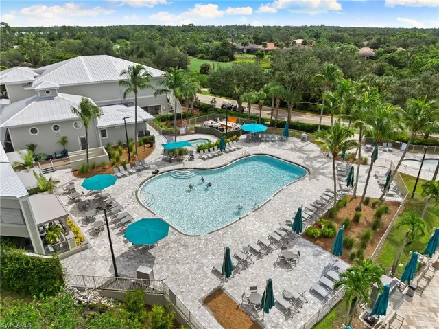 an aerial view of a garden with swimming pool