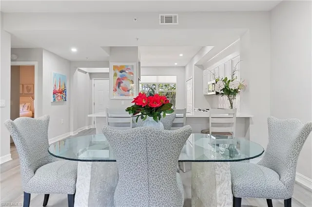 a dining room with furniture and chandelier