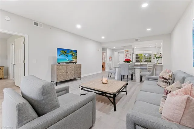 a living room with furniture and a table