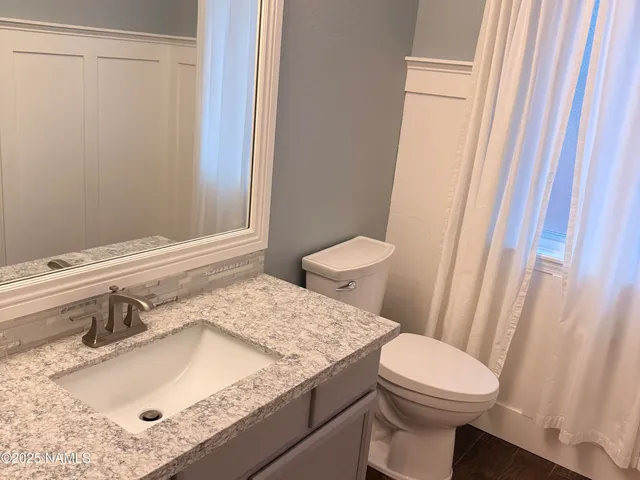 a bathroom with a sink and a toilet