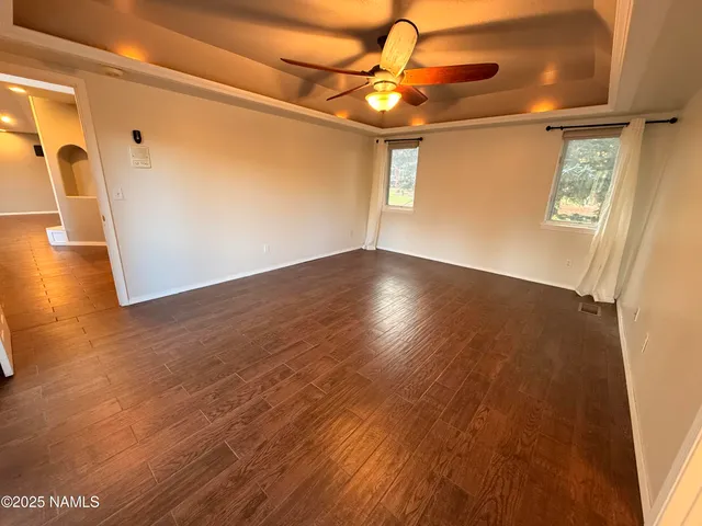 a view of a livingroom with wooden floor