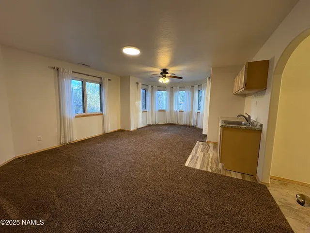 a view of empty room with windows