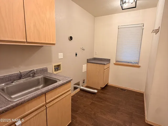 a kitchen with stainless steel appliances granite countertop a refrigerator and a stove