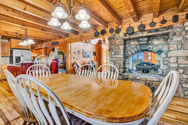a view of a porch with furniture and wooden floor