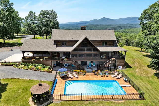 a view of house with outdoor space and garden
