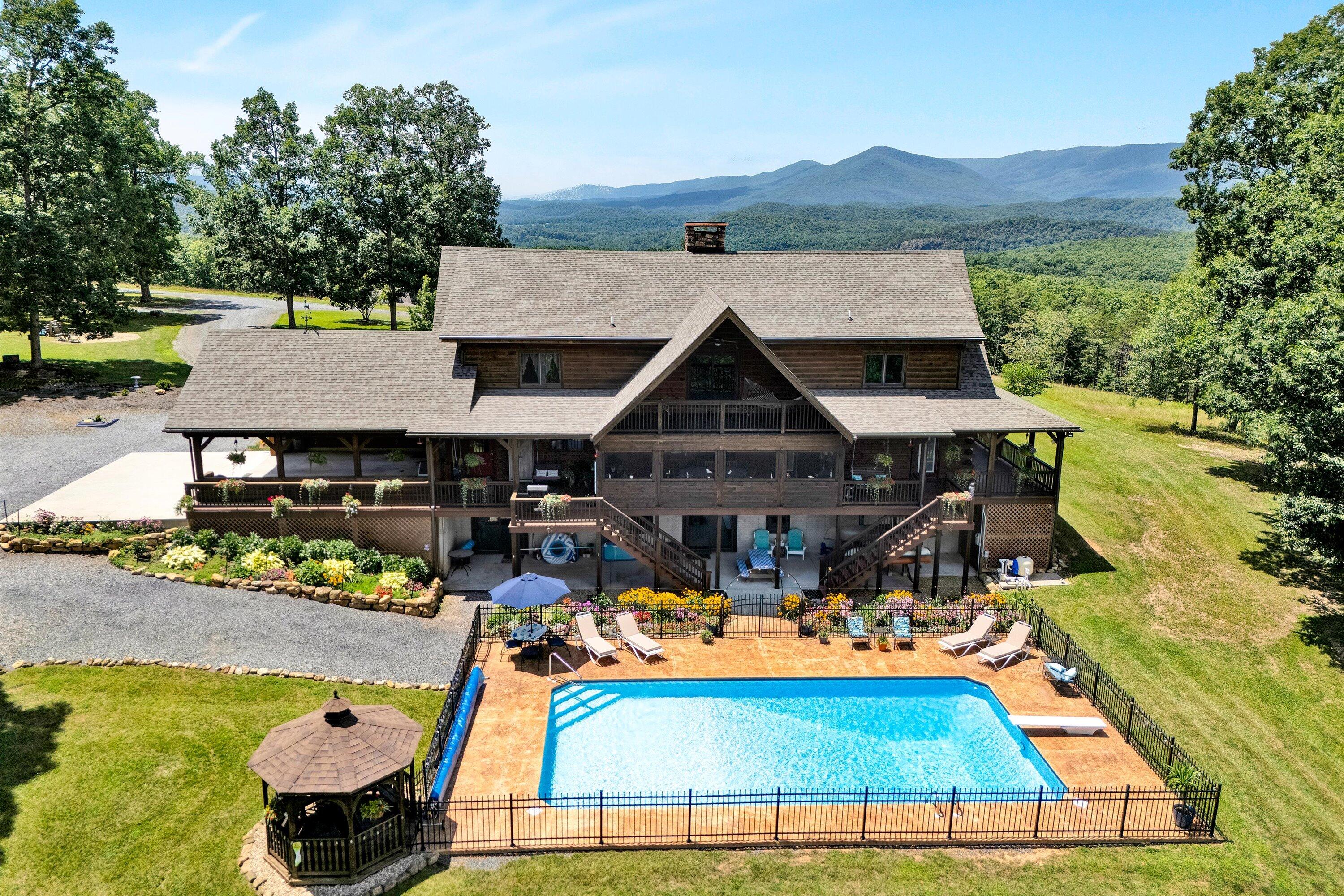 500 Jacksons Flat Covington, VA 24426 - Photo 2 of 102 an aerial view of a house with garden space and sitting area