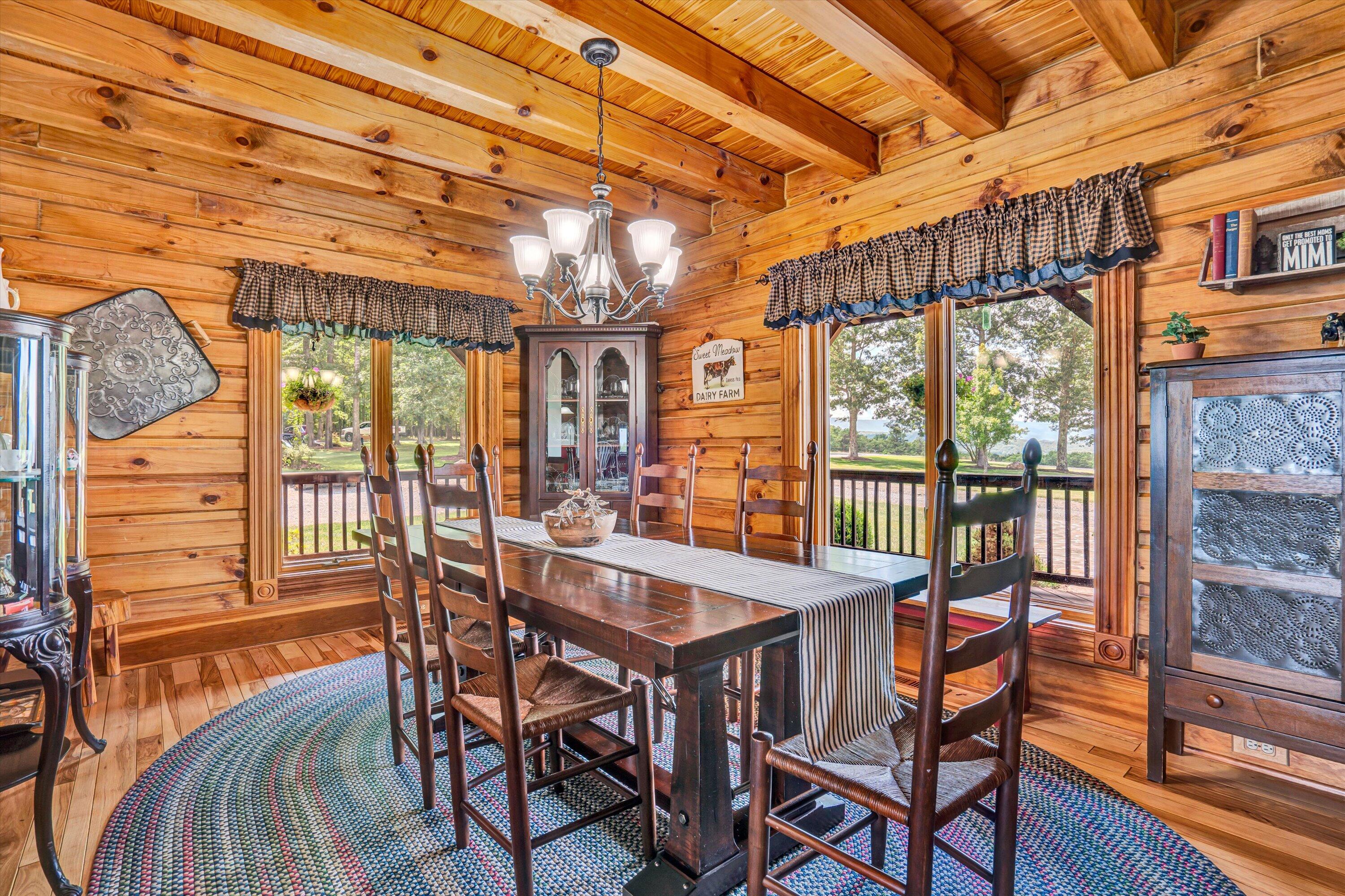 500 Jacksons Flat Covington, VA 24426 - Photo 23 of 102 a view of a dining room with furniture large windows and wooden floor