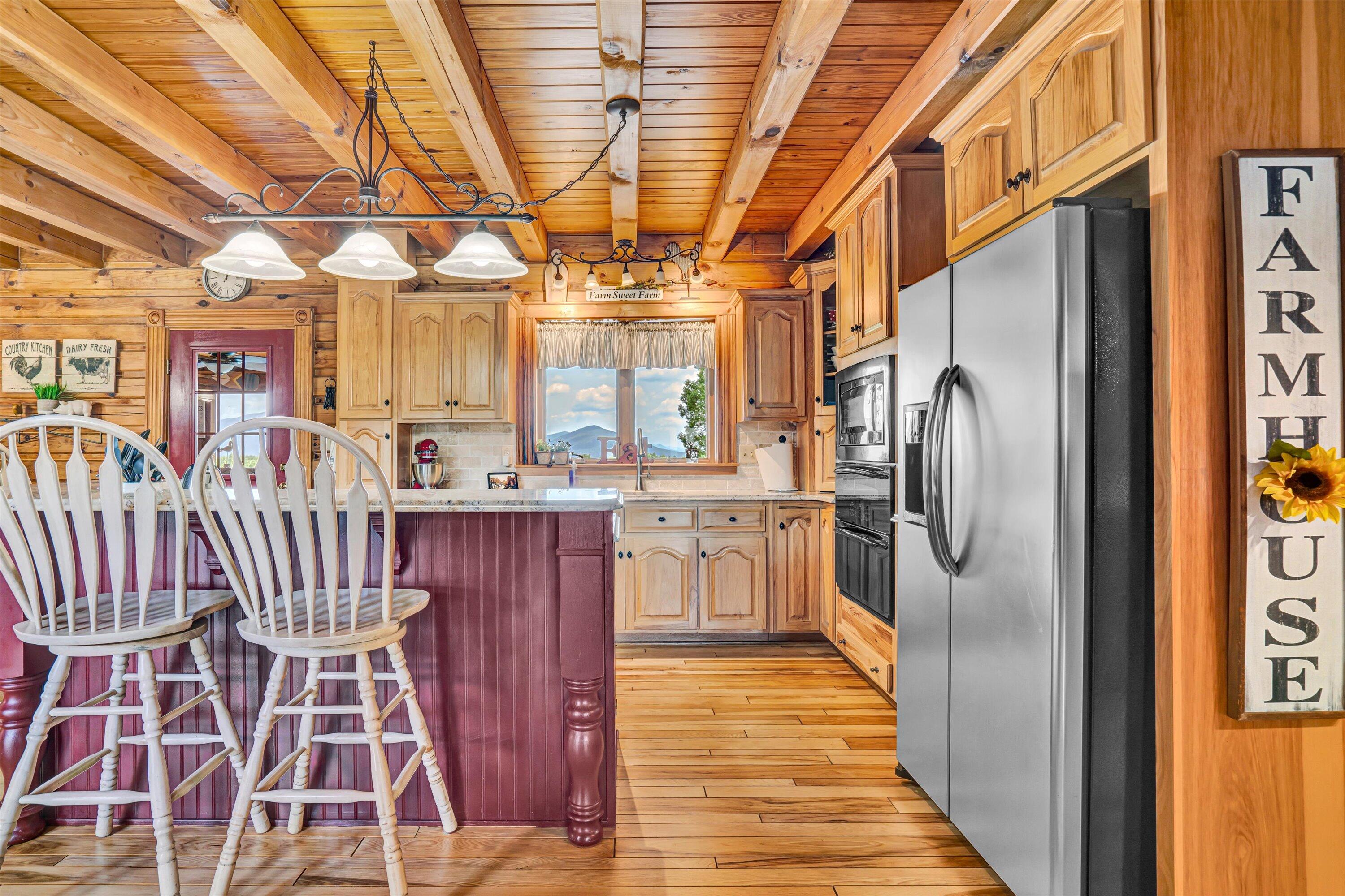 500 Jacksons Flat Covington, VA 24426 - Photo 24 of 102 a kitchen with stainless steel appliances granite countertop a refrigerator and a sink