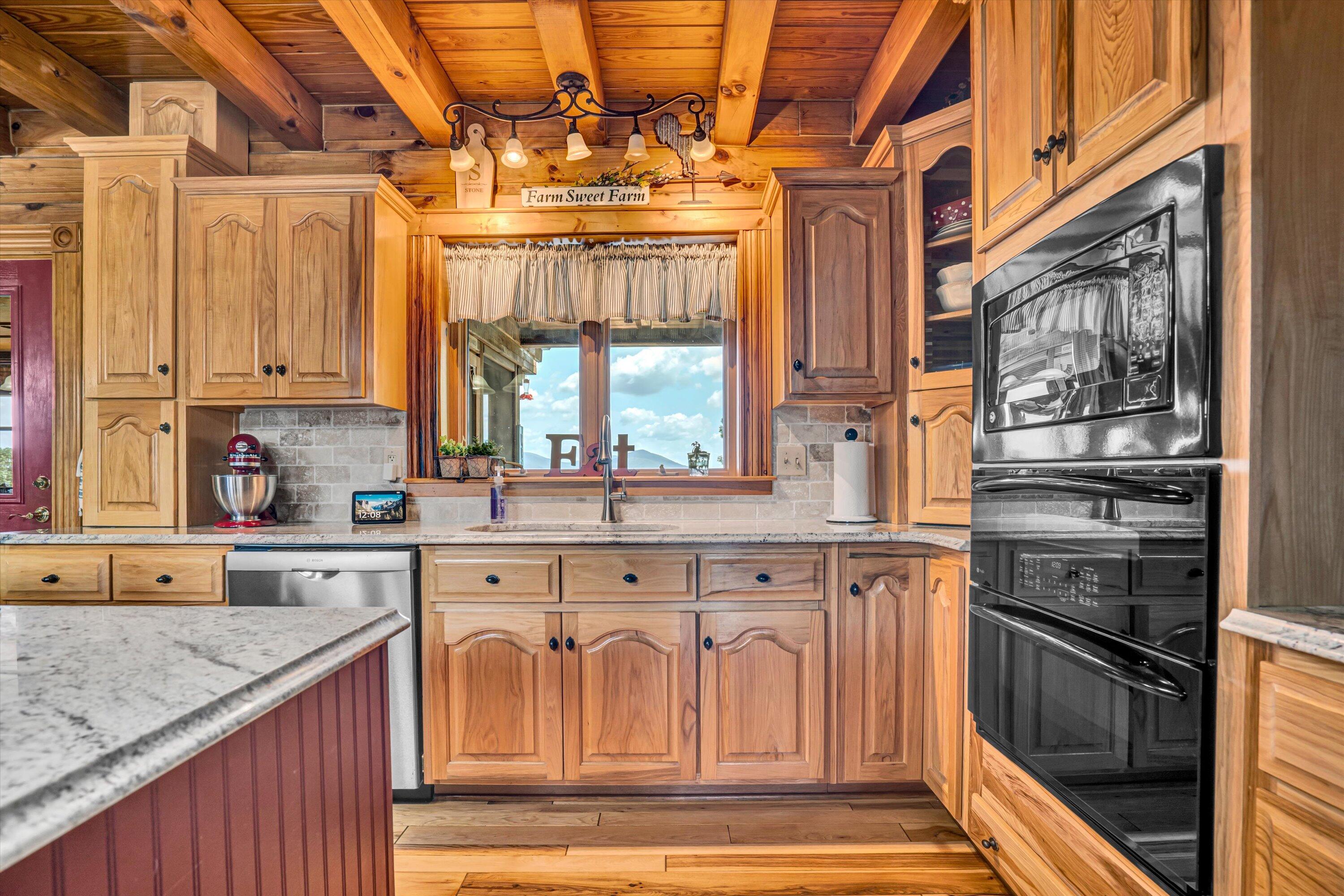 500 Jacksons Flat Covington, VA 24426 - Photo 29 of 102 a kitchen with stainless steel appliances granite countertop a stove and a sink