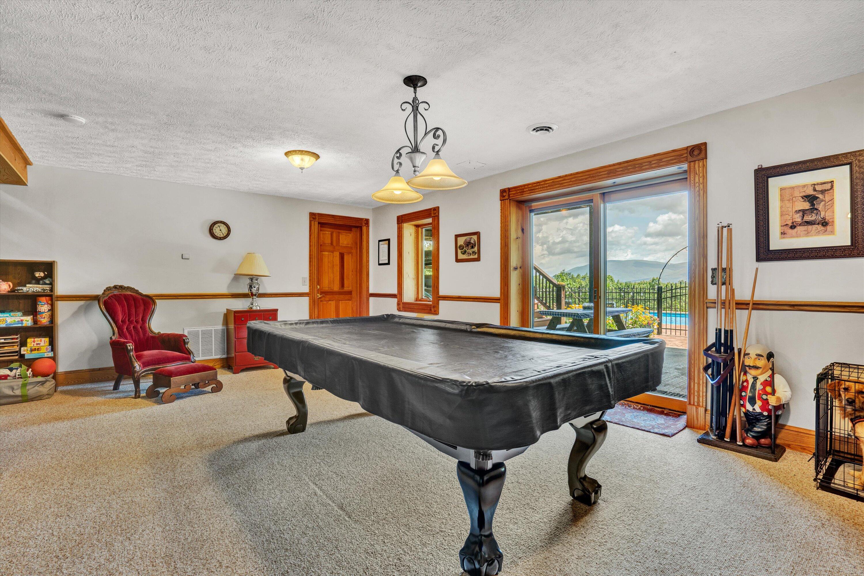 500 Jacksons Flat Covington, VA 24426 - Photo 81 of 102 a living room with furniture a window and a chandelier