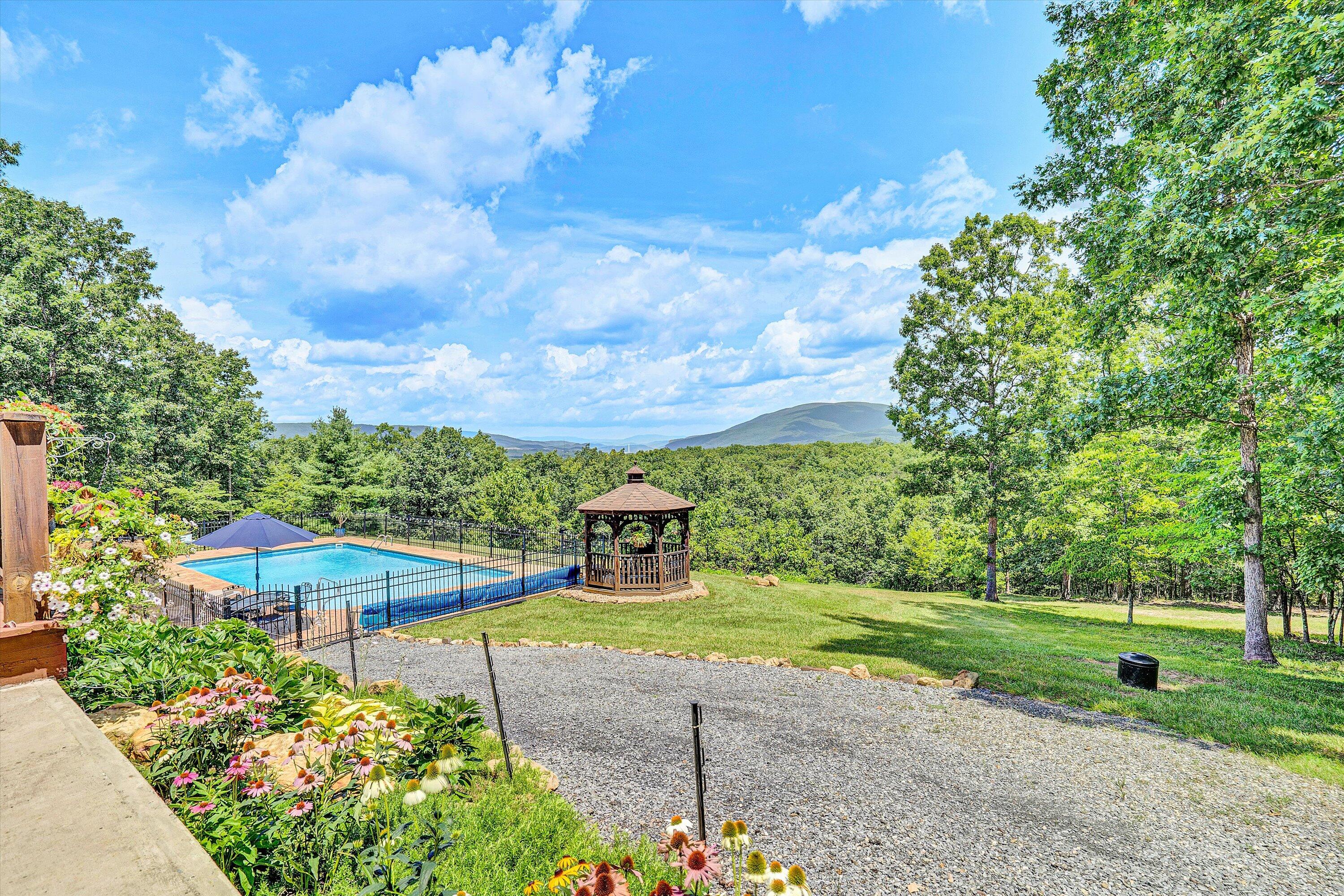 500 Jacksons Flat Covington, VA 24426 - Photo 92 of 102 a view of a garden with a building in the background