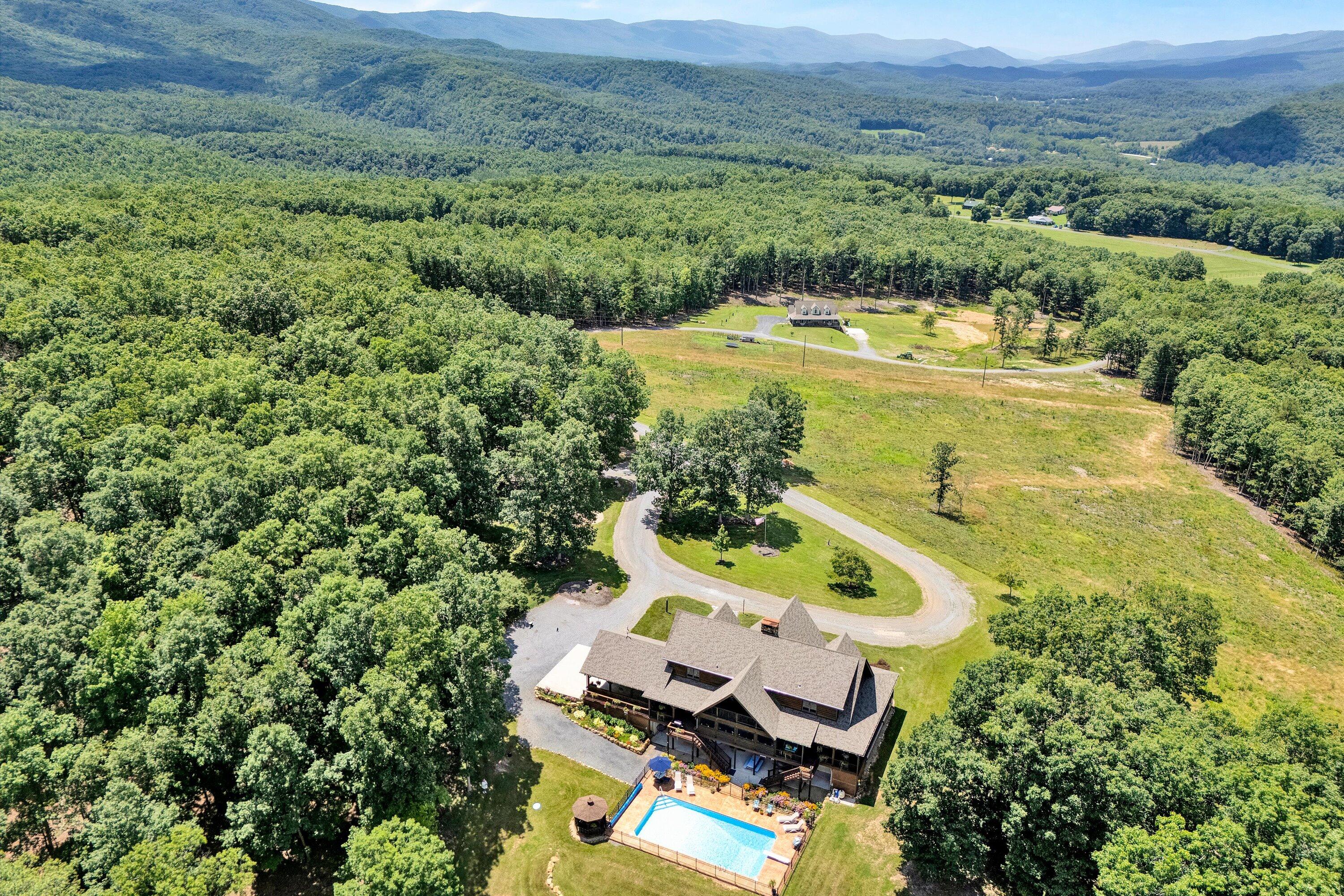 500 Jacksons Flat Covington, VA 24426 - Photo 98 of 102 an aerial view of a house with a garden and swimming pool