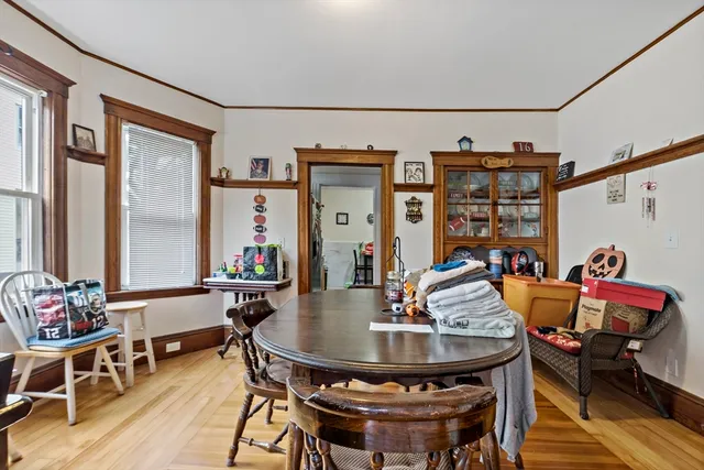 a view of a dining room with furniture and window
