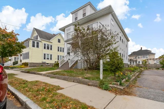 a view of a car park in front of house
