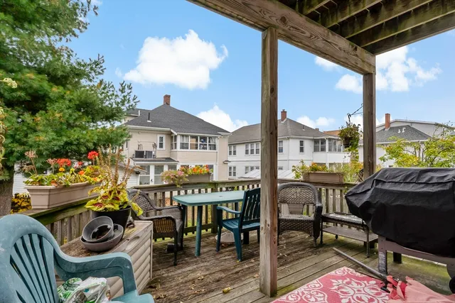 a front view of a house with outdoor seating