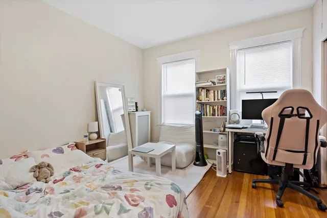 a bedroom with a bed and furniture