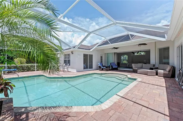 a view of a swimming pool with a patio