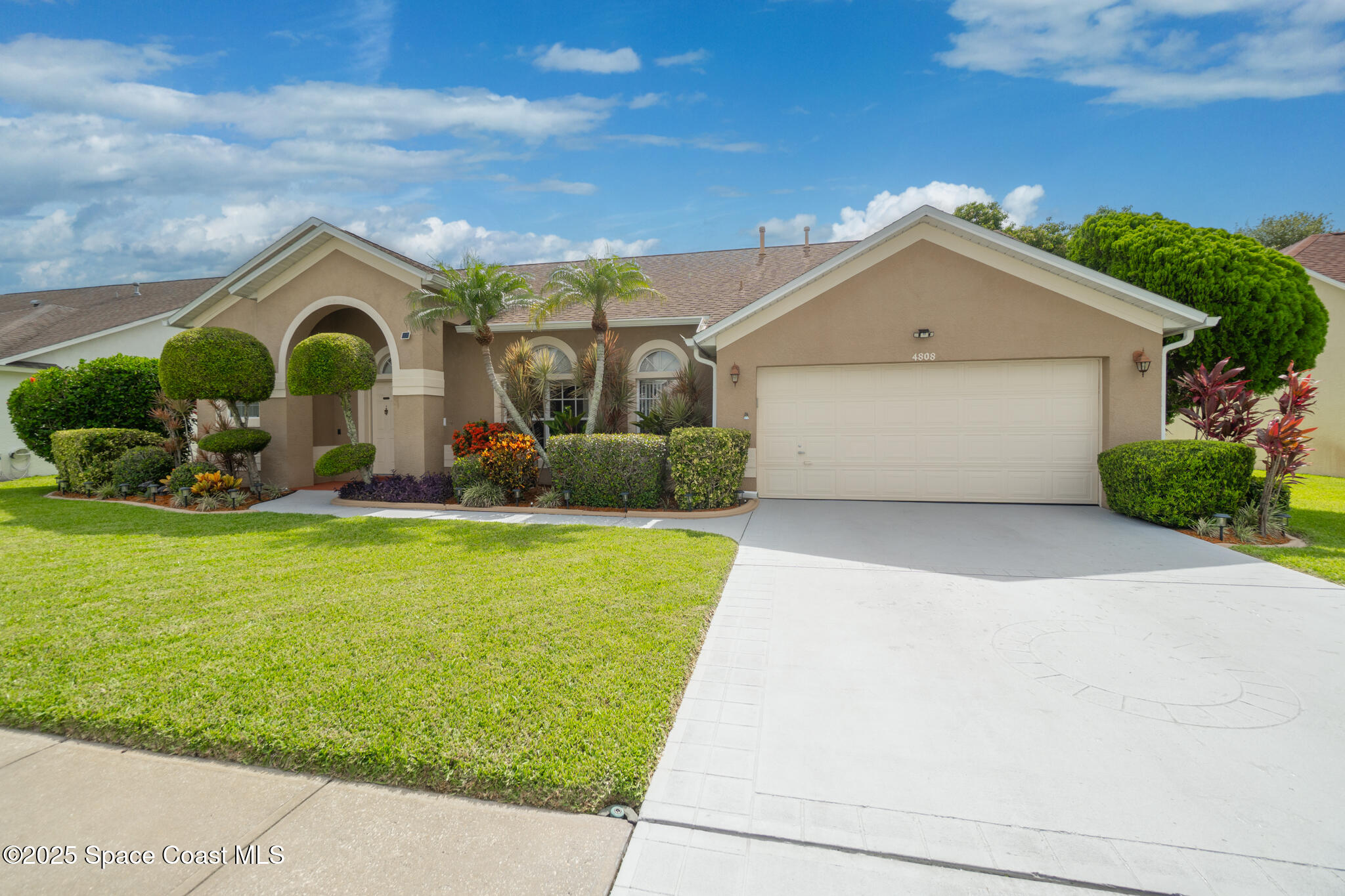 4808 Springwater Circle Melbourne, FL 32940 - Photo 1 of 38 a front view of house with yard and green space