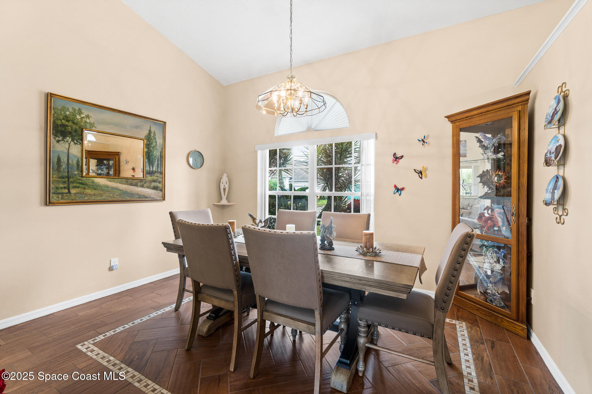 4808 Springwater Circle Melbourne, FL 32940 - Photo 13 of 38 a view of a dining room with furniture window and wooden floor