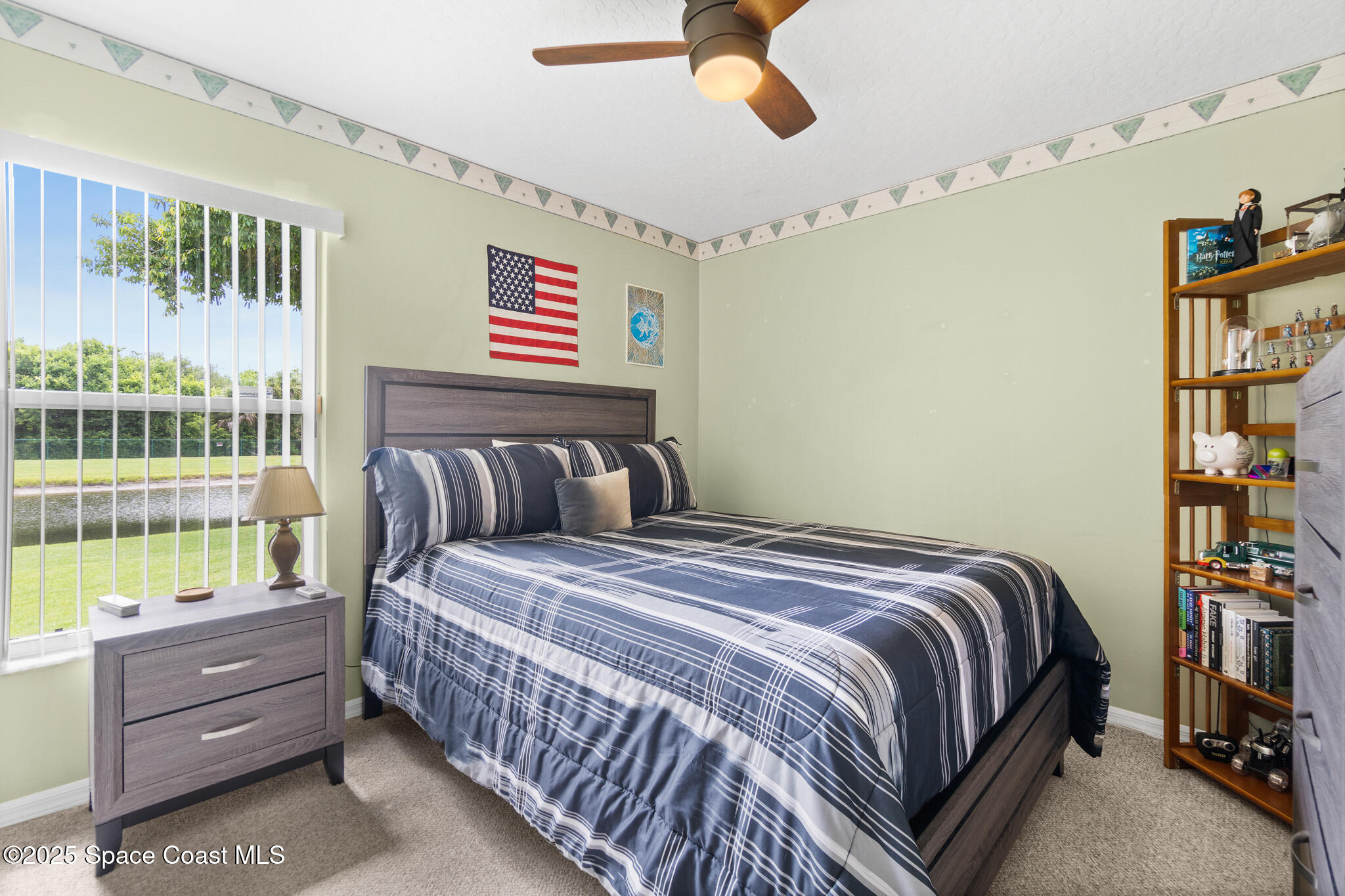 4808 Springwater Circle Melbourne, FL 32940 - Photo 20 of 38 a bedroom with a bed and a window