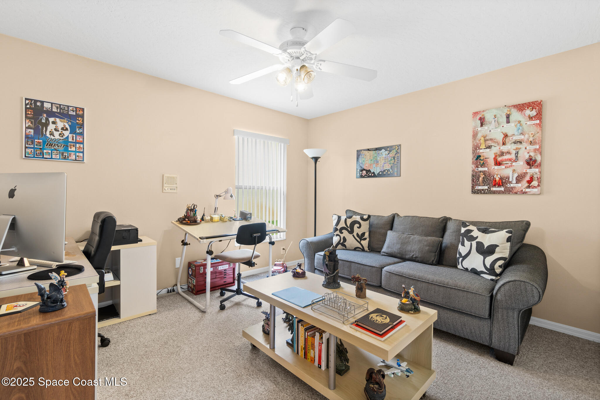 4808 Springwater Circle Melbourne, FL 32940 - Photo 22 of 38 a living room with furniture and a chandelier