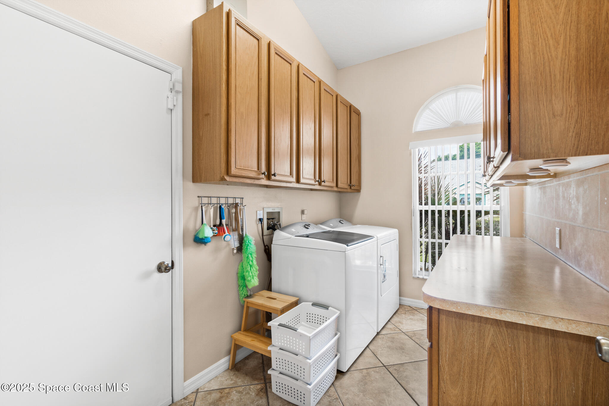 4808 Springwater Circle Melbourne, FL 32940 - Photo 26 of 38 a view of a kitchen with storage and utility