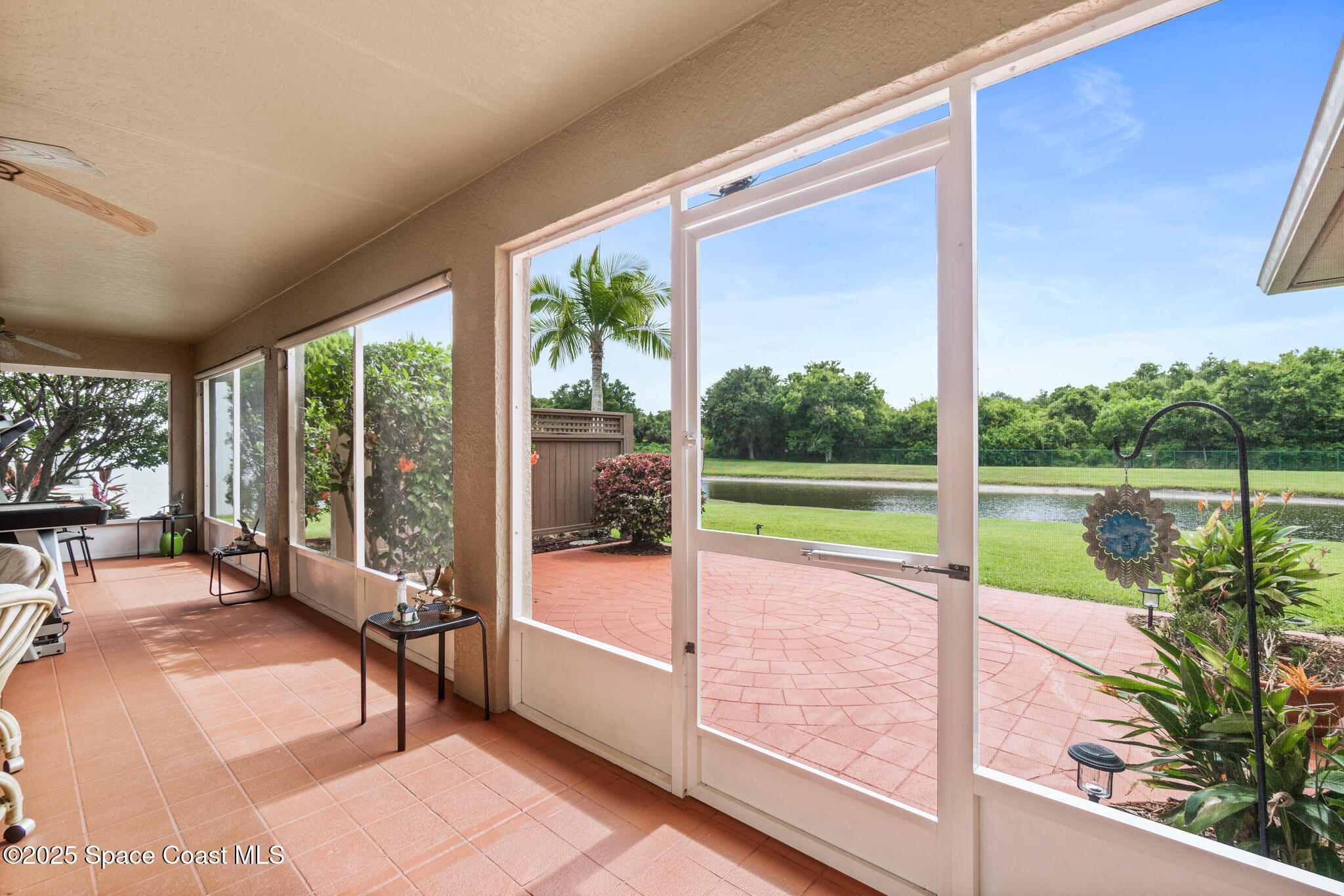 4808 Springwater Circle Melbourne, FL 32940 - Photo 27 of 38 a view of a swimming pool with a porch