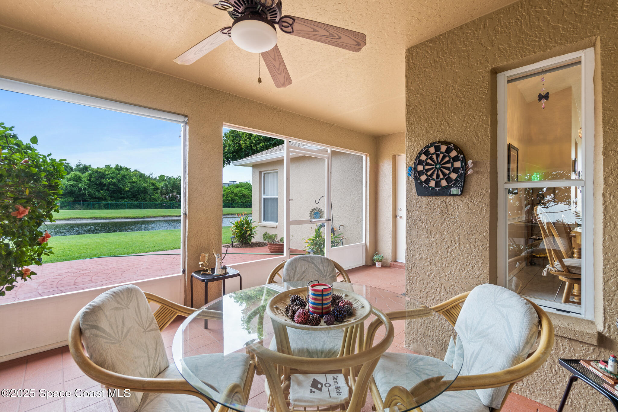 4808 Springwater Circle Melbourne, FL 32940 - Photo 28 of 38 a living room with furniture and a large window